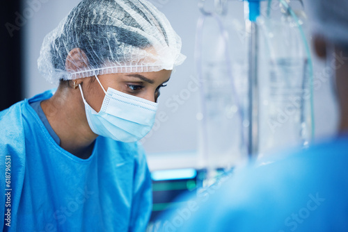 Theatre, team and surgeon woman or doctors of medical support, hospital or healthcare solution in face mask. Focus, thinking and nurses in surgery, operating room and emergency or life insurance help