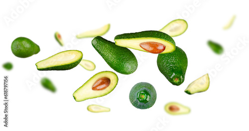 Excellent set of avocados. Whole  halves and quarters of avocado flying and levitate in space isolated on white background. Excellent retouching and high resolution