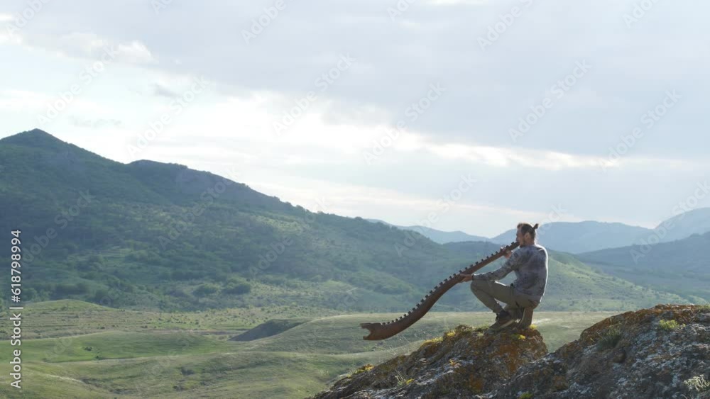A musician plays the Australian Aboriginal musical instrument