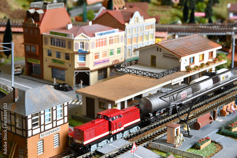 Miniature railway model with trains. Toy Train with wagons at Railway Station in a city. Miniature railway model with trains. Toy Train with wagons at Railway Station in a city.