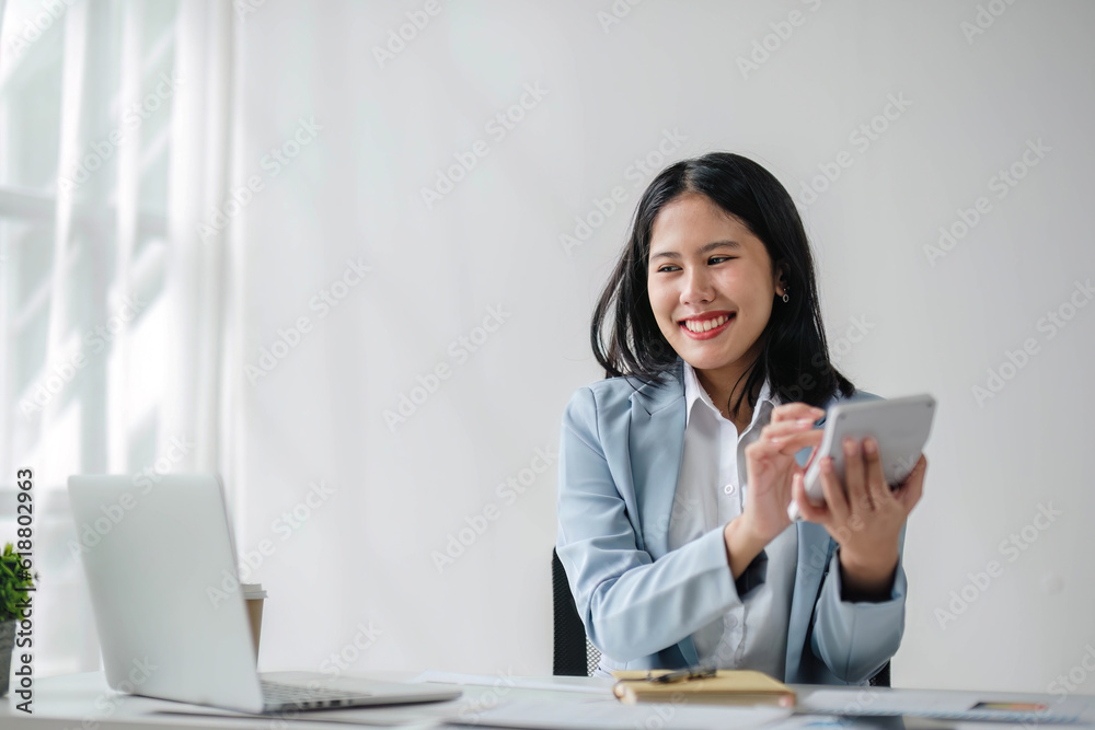 Business woman using calculator for do math finance on wooden desk in office and business working background, tax, accounting, statistics and analytic research concept.. Business woman using calculator for do math finance on wooden desk in office and business working background, tax, accounting, statistics and analytic research concept..