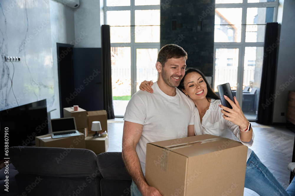 Guy holds the box in his hands next to wife Guy holds the box in his hands next to wife