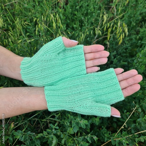 A pair of hands wearing gloves