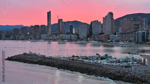 Bendorm city in Spain at sunset with red sky photo