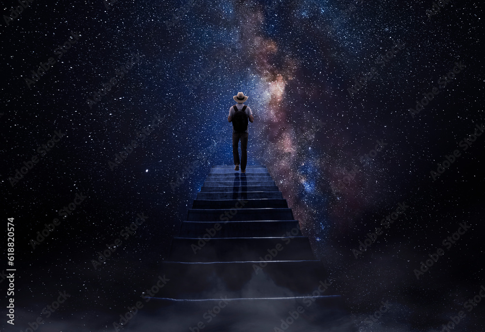 Man observing the universe at the end of the stairs