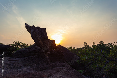 .scenery sunrise at weird shaped rock..These stones have been meticulously formed by nature to create a stunning visual masterpiece..The stones had been carved and shaped into incredible structures.. photo