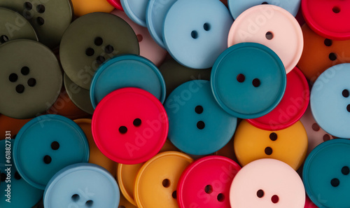 Background of plastic round buttons of different colors