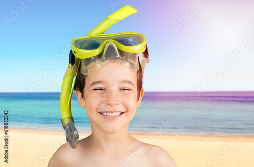Child with snorkel mask tuba and snorkel. Snorkeling, swimming, vacation concept at tropical beach.Caucasian male model