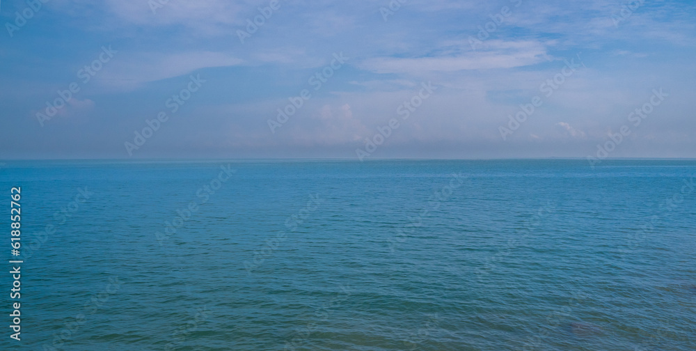 Panorama front view landscape Blue sea rock and sky blue background morning day look calm summer Nature tropical sea Beautiful ocen water travel Bangsaen Beach East thailand Chonburi Exotic horizon.