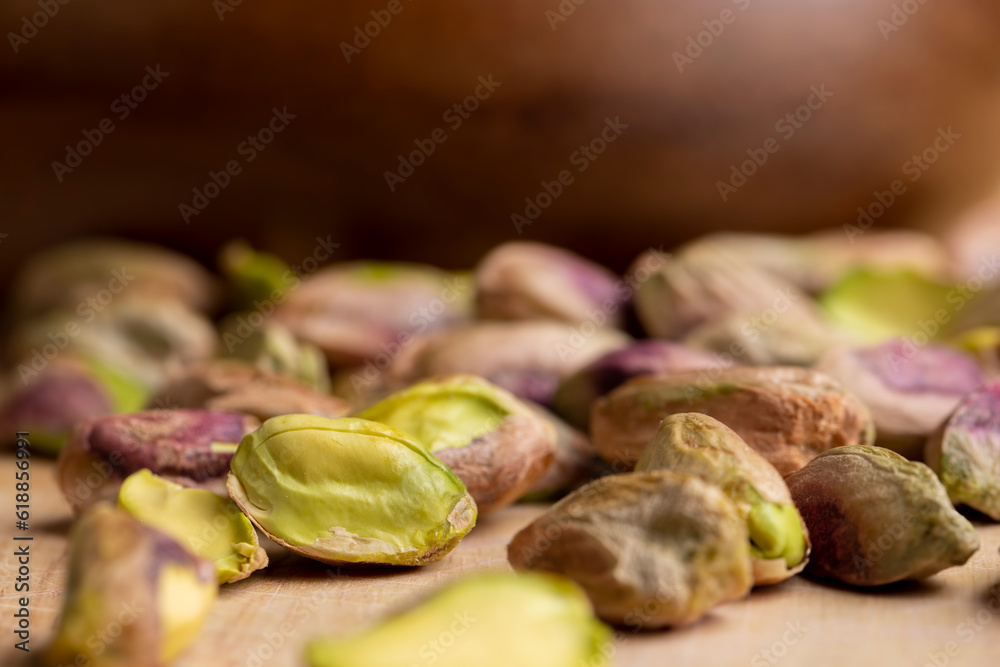 Crispy delicious pistachios with salt on the table Crispy delicious pistachios with salt on the table