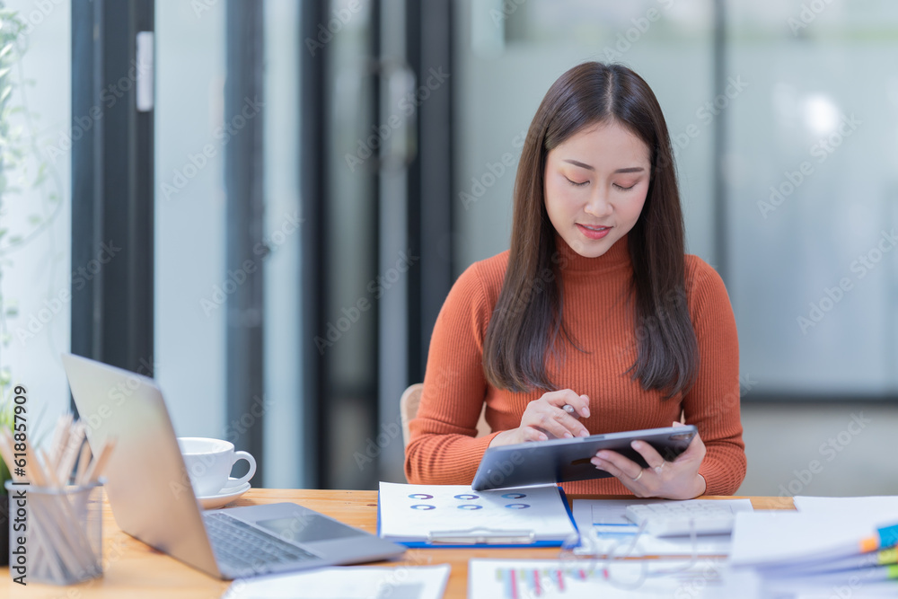 Woman using on the phone by the laptop. Working at the office, freelancing. Woman using on the phone by the laptop. Working at the office, freelancing.