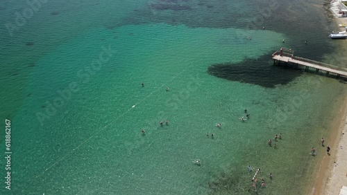 Drone view of Ayvalık Sarimsakli beach and people swimming in the sea photo