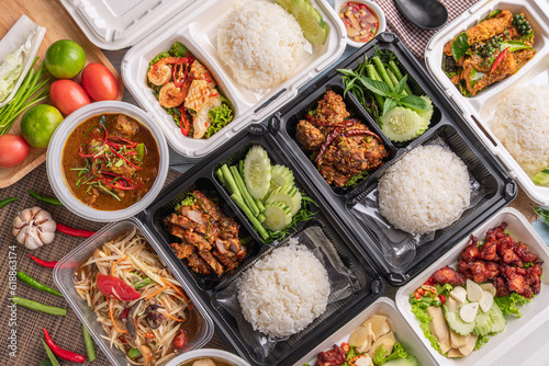 top table view of thai food in derivery box.
