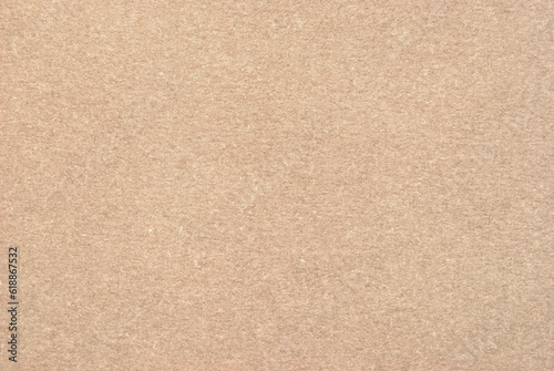 A sheet of beige recycled cardboard texture as background 