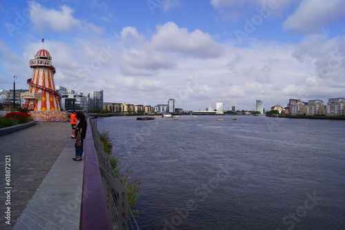 A view of the river bank, the river Thames, and the helter skelter in Greenwich village (London, UK) photo