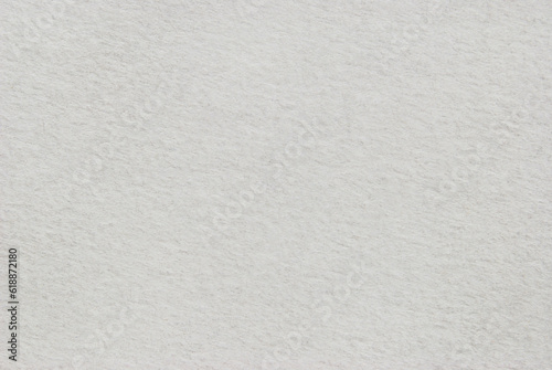 Watercolor paper texture as background, macro image of a white rouge paper pattern 