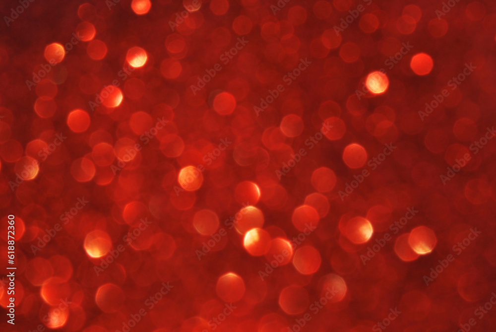 Red de focused sparkle glitter background with golden particles close up
Red de focused sparkle glitter background with golden particles close up