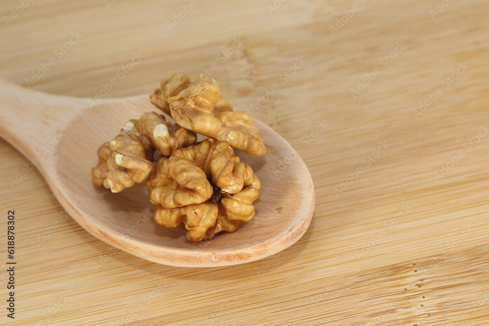 Fototapeta premium walnuts on wooden spoon