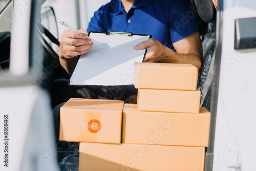 Starting small businesses SME owners man entrepreneurs working, box and check online orders to prepare to pack the boxes, sell to customers, sme business ideas online. © ARMMY PICCA