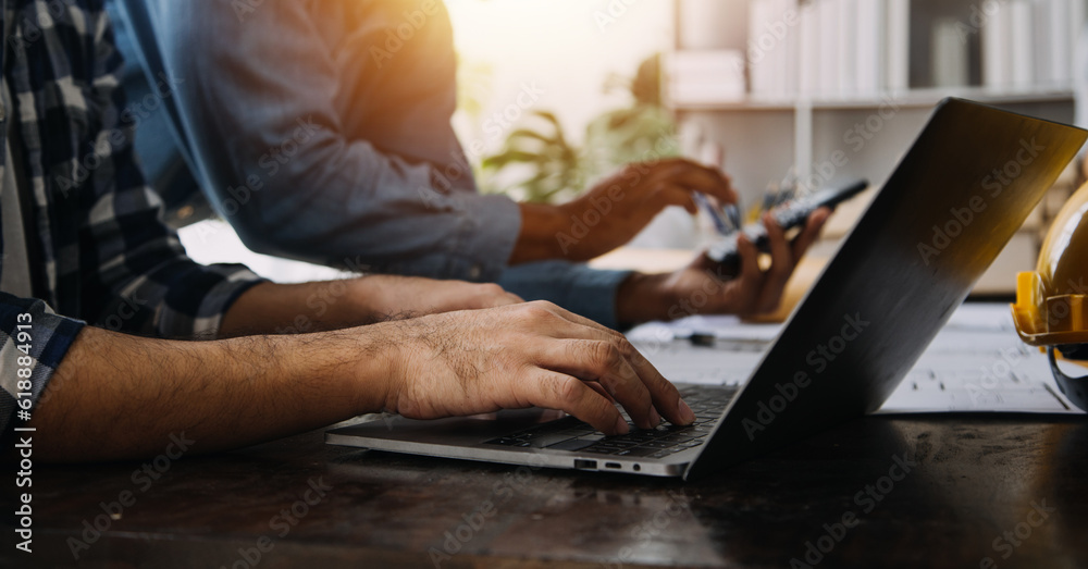 Close up Business woman using calculator and laptop for do math finance on wooden desk, tax, accounting, statistics and analytical research concept Close up Business woman using calculator and laptop for do math finance on wooden desk, tax, accounting, statistics and analytical research concept