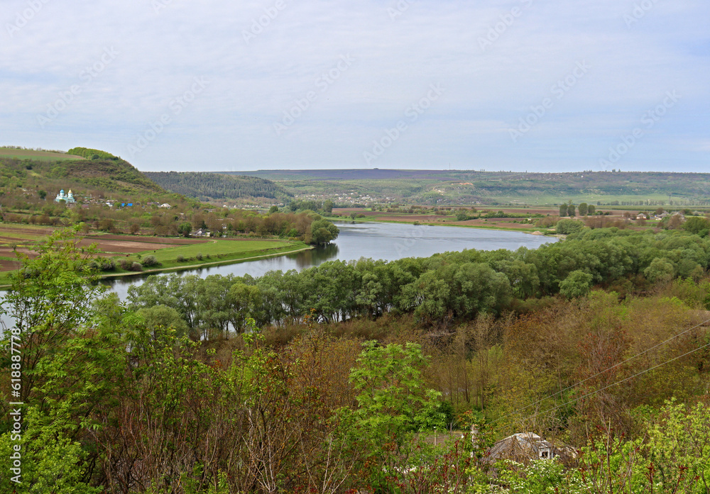 Scenic bird's eye view of the village, hills and houses on the other side of the river