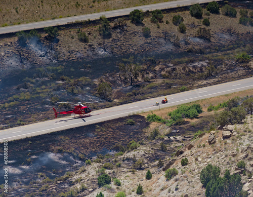 Helicopter and crew fighting a wildfire