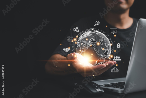 Corporate leadership in the digital age. Person's hand holding virtual Global Internet connection icon. Business, technology, and digital marketing concept. Financial and banking solutions.