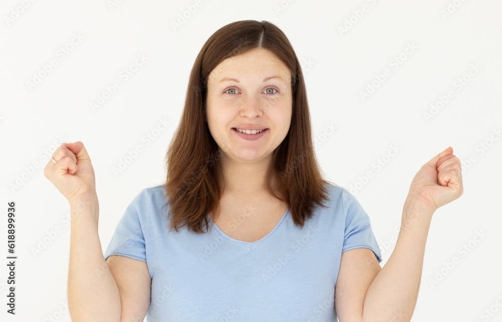 Enthusiastic woman rejoicing, say yes, looking happy and celebrating victory, champion dance, fist pump gesture, standing over white background Enthusiastic woman rejoicing, say yes, looking happy and celebrating victory, champion dance, fist pump gesture, standing over white background