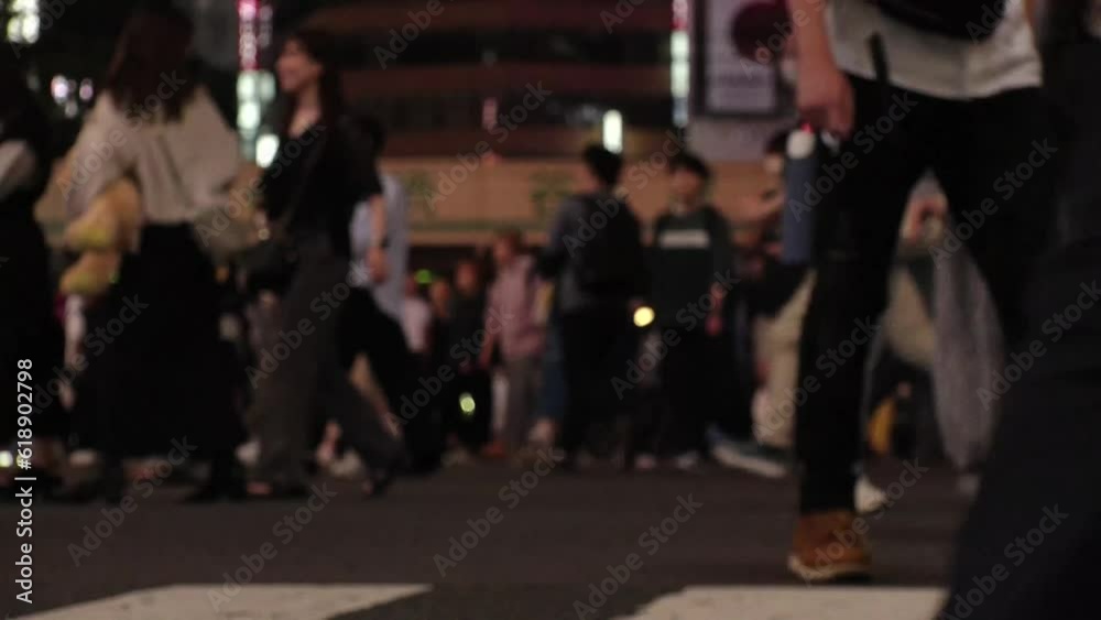 SHIBUYA, TOKYO, JAPAN - JUNE 2023 : Time lapse shot of crowd of people walking at Shibuya crossing at night. Busy downtown area in Tokyo. Japanese people, urban city life and traffic concept 4K video. SHIBUYA, TOKYO, JAPAN - JUNE 2023 : Time lapse shot of crowd of people walking at Shibuya crossing at night. Busy downtown area in Tokyo. Japanese people, urban city life and traffic concept 4K video.