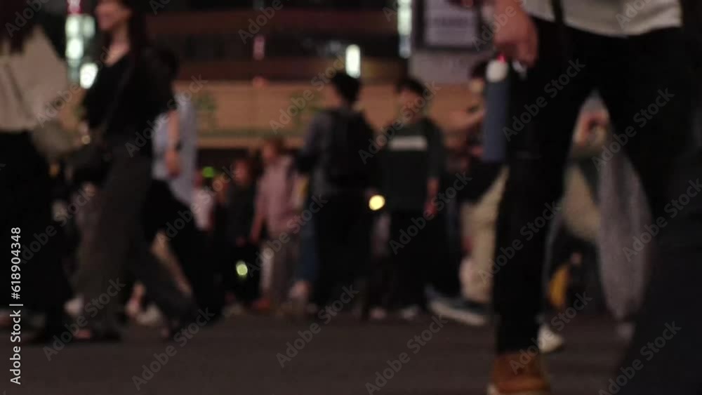 SHIBUYA, TOKYO, JAPAN - JUNE 2023 : Time lapse shot of crowd of people walking at Shibuya crossing at night. Busy downtown area in Tokyo. Japanese people, urban city life and traffic concept 4K video. SHIBUYA, TOKYO, JAPAN - JUNE 2023 : Time lapse shot of crowd of people walking at Shibuya crossing at night. Busy downtown area in Tokyo. Japanese people, urban city life and traffic concept 4K video.
