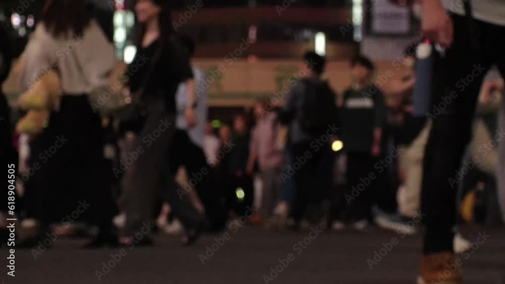 SHIBUYA, TOKYO, JAPAN - JUNE 2023 : Time lapse shot of crowd of people walking at Shibuya crossing at night. Busy downtown area in Tokyo. Japanese people, urban city life and traffic concept 4K video. SHIBUYA, TOKYO, JAPAN - JUNE 2023 : Time lapse shot of crowd of people walking at Shibuya crossing at night. Busy downtown area in Tokyo. Japanese people, urban city life and traffic concept 4K video.