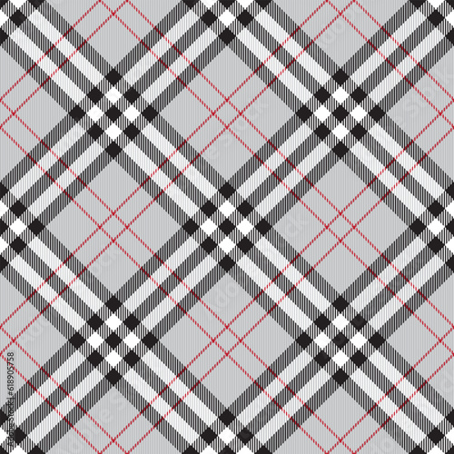 Traditional Scottish checkered plaid ornament. Diagonal vintage tartan texture seamless pattern. Coloured geometric intersecting striped vector illustration. Seamless fabric texture.