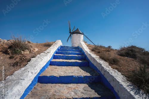 Blue and White Steps and Espartero Windimill - Consuegra, Castilla-La Mancha, Spain photo