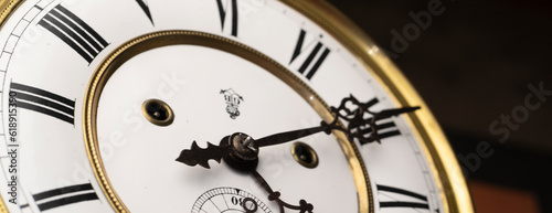 Vintage Clock with Hands.Close up view on clock face of a historical watches with golden frame