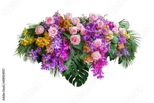 Pink rose and orchid flowers with tropical green leaves Monstera and palm frond bush, floral arrangement nature backdrop