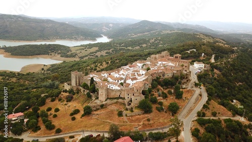 aerial view of Castillo de Castellar, medieval town within a castle in Andalusia at a cloudy day, Castellar de la Frontera, province of Cádiz, Spain