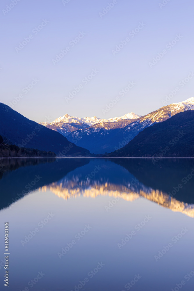 Calm lake with a reflection of a mountain landscape