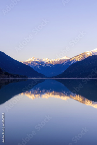 Calm lake with a reflection of a mountain landscape #618940195