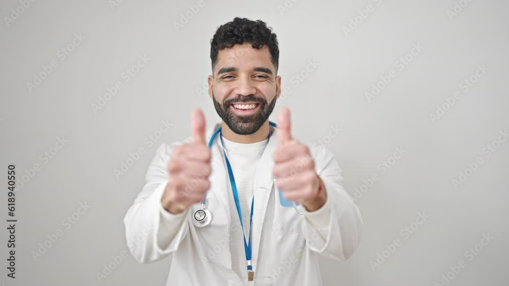 Young hispanic man doctor doing thumbs up over isolated white background Young hispanic man doctor doing thumbs up over isolated white background