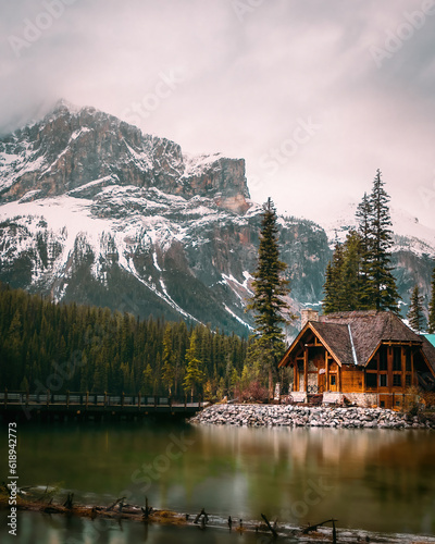 Wooden cabin in the middle of an Emerald lake
