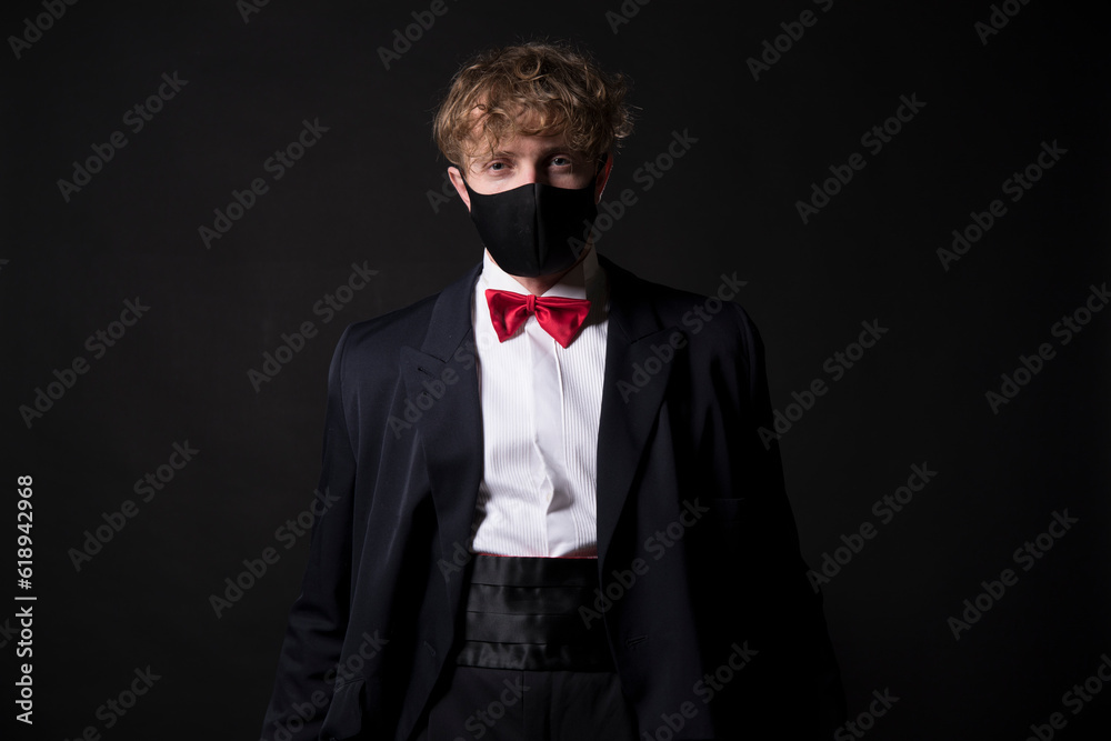 Elegant man posing on dark background
