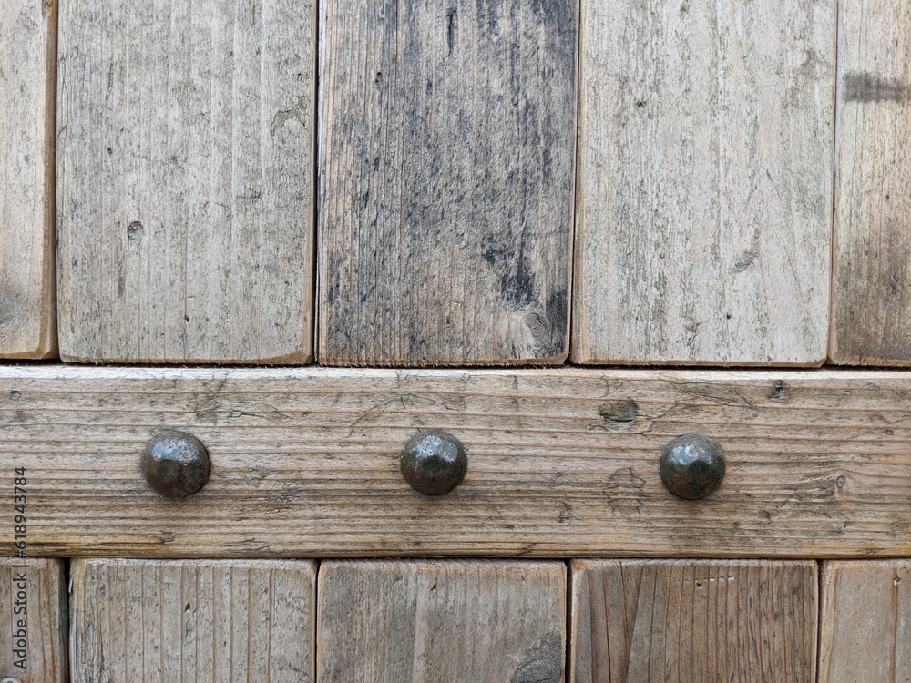 Decorative nails of a wooden door Decorative nails of a wooden door