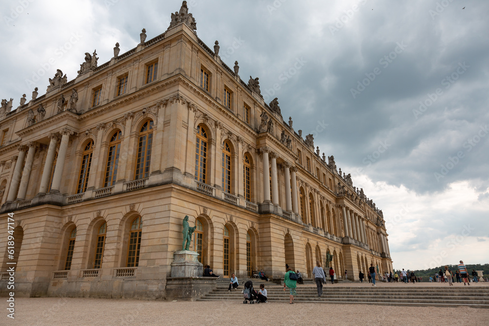 Paris, France - May 20, 2023: exterior, architecture and park outdoors of the Palace Versailles royal chateau UNESCO list of World Heritage Sites.