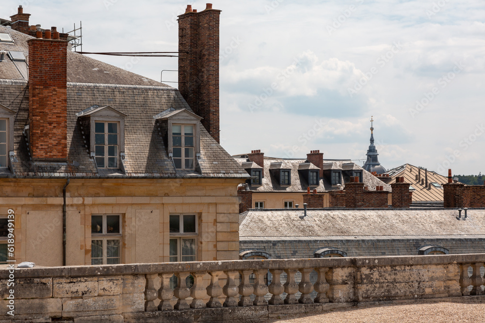 Fototapeta premium Paris, France - May 20, 2023: exterior, architecture and park outdoors of the Palace Versailles royal chateau UNESCO list of World Heritage Sites.