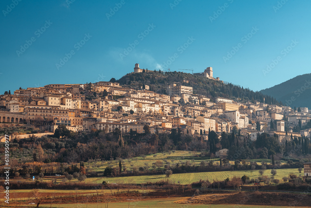 Assisi, Italy town skyline with the Basilica of Saint Francis of Assisi