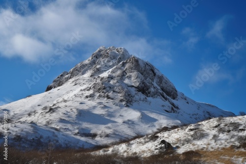 snow-covered mountain peak with clear blue sky and clouds visible above, created with generative ai © Alfazet Chronicles
