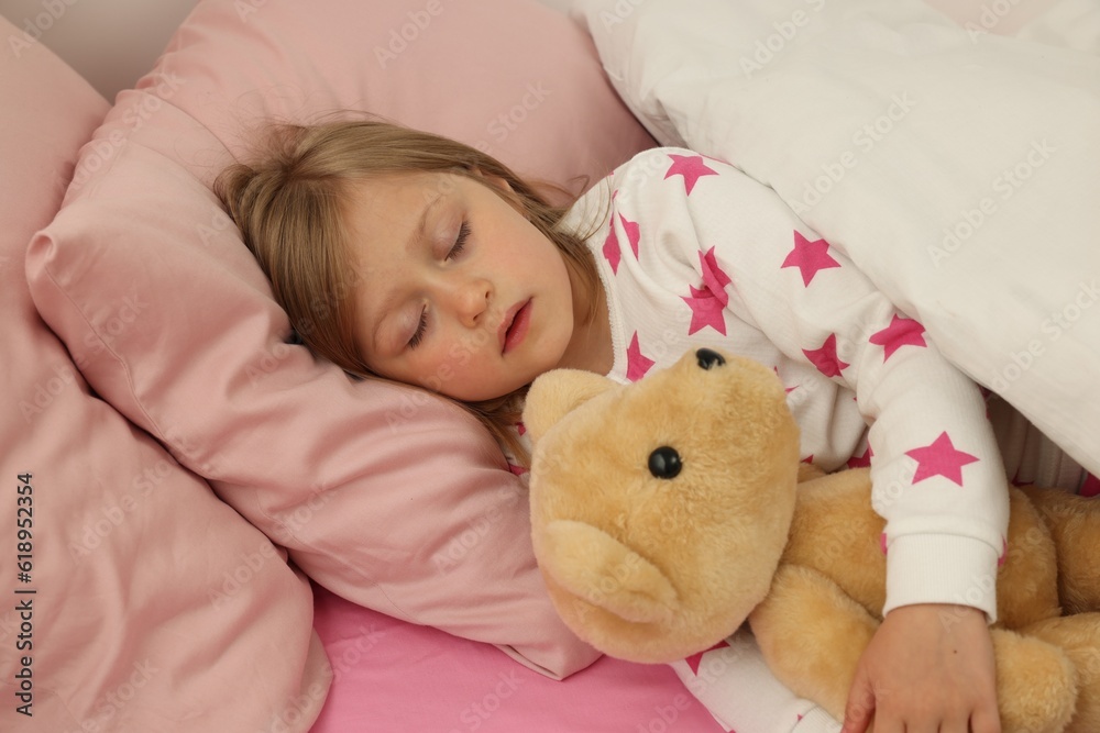 Little girl snoring while sleeping in bed Little girl snoring while sleeping in bed