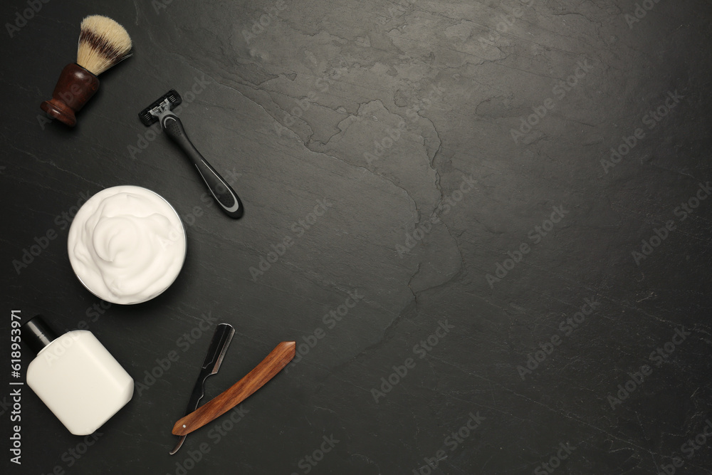 Set of men's shaving tools on black textured table, flat lay. Space for text Set of men's shaving tools on black textured table, flat lay. Space for text