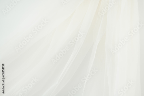 Fototapeta Naklejka Na Ścianę i Meble -  Ivory or White Sheer Chiffon Fabric Hanging on White Background