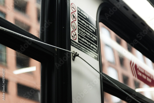 Close-up of bus passenger pull cord to request stop photo